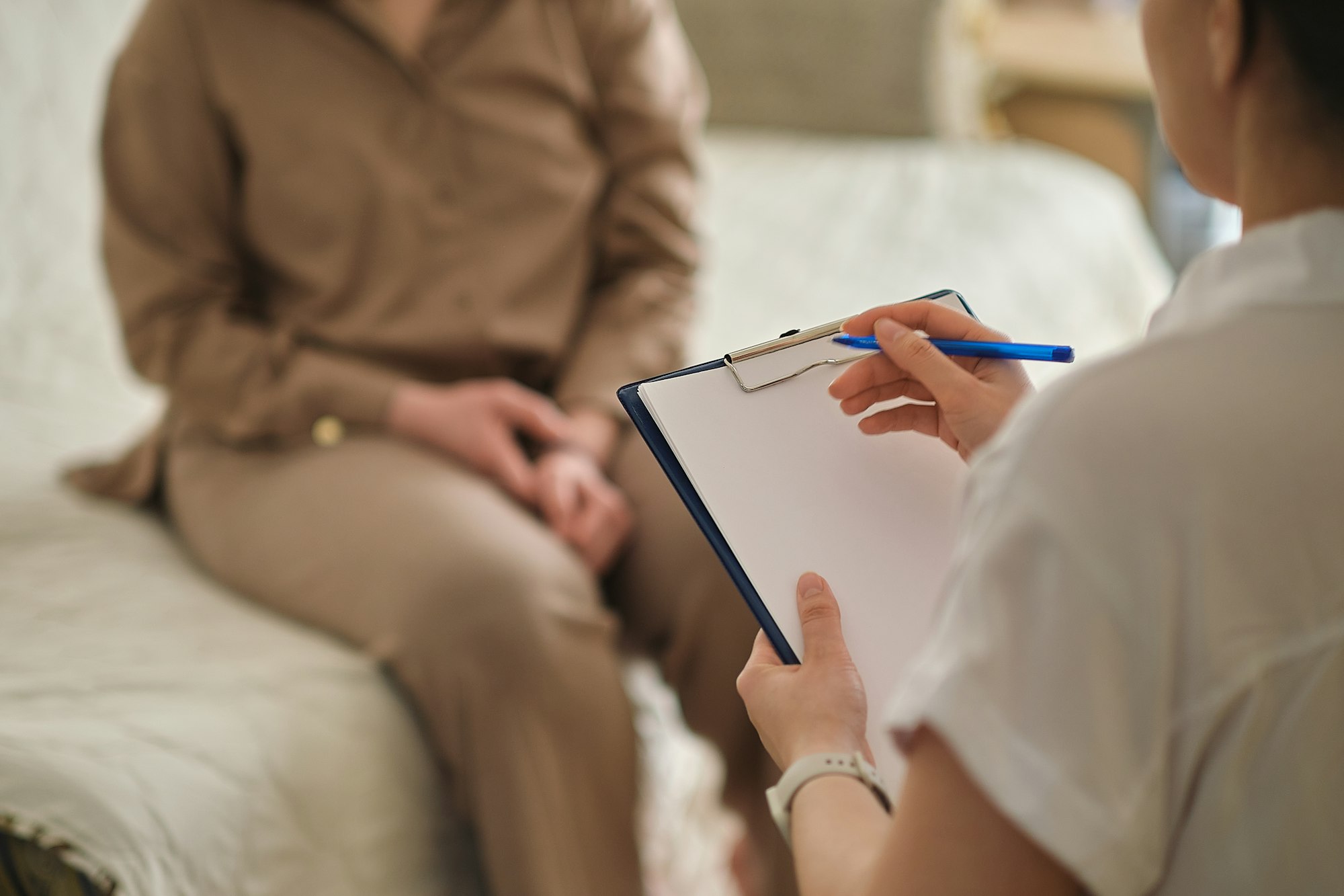 patient makes progress towards healing and recovery as she talks with her therapist about her